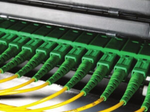 depiction of green network cables lined up in row in network environment