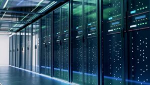 Line-up of modern working server cabinets in data center with lights on them. Green reflection on door provides light.